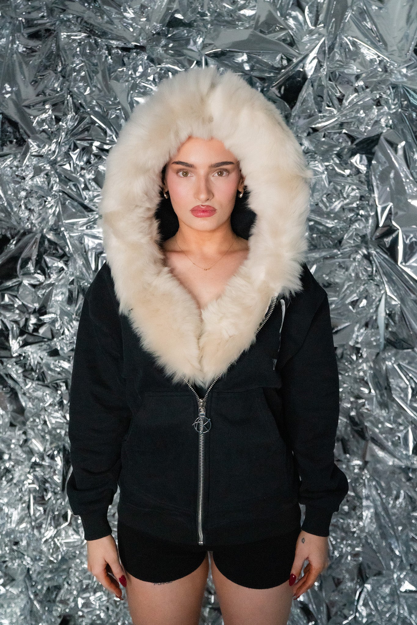 front view of model wearing GENUINE MERINO FUR PEACE ZIP HOODIE