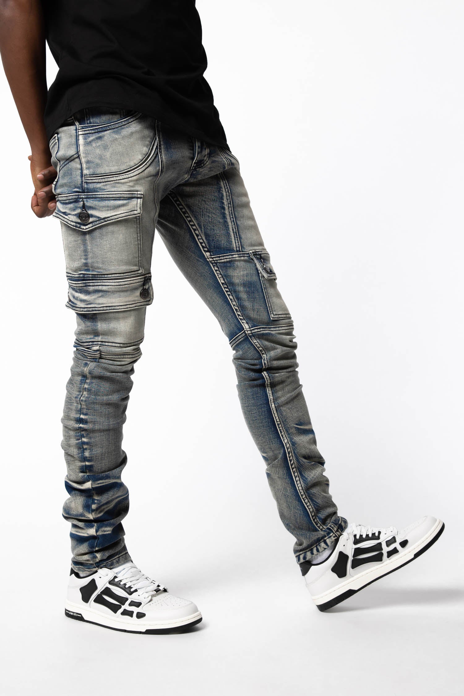 detail of stack fold and fading of kyle blue jeans