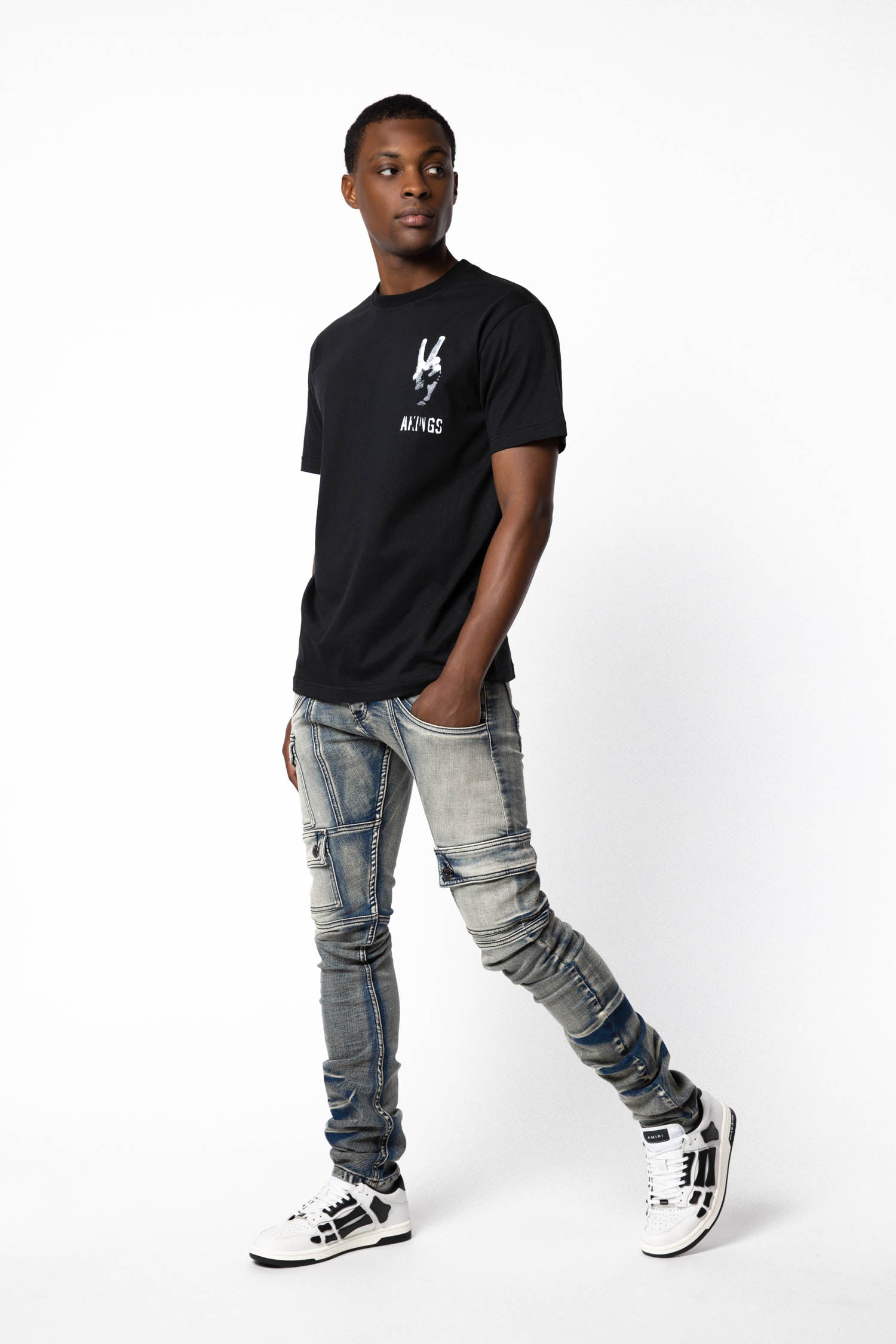 model showing the side inseam detail of Peace T-shirt