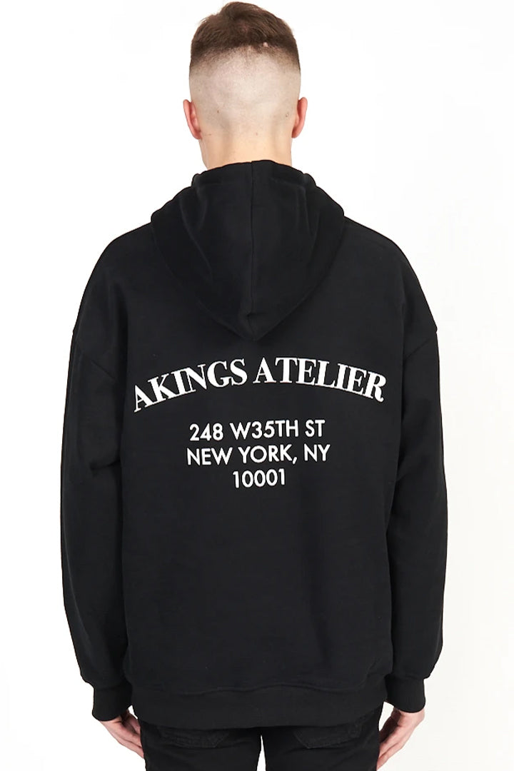 back view of Atelier Hoodie showing hood detail and screen print