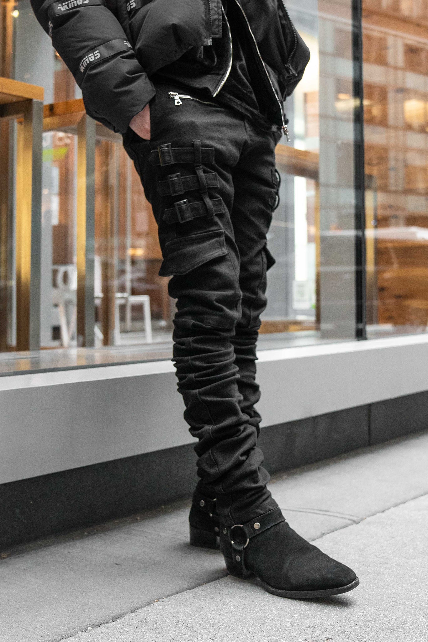 Close-up of hem stack detail on Black Omari Jeans