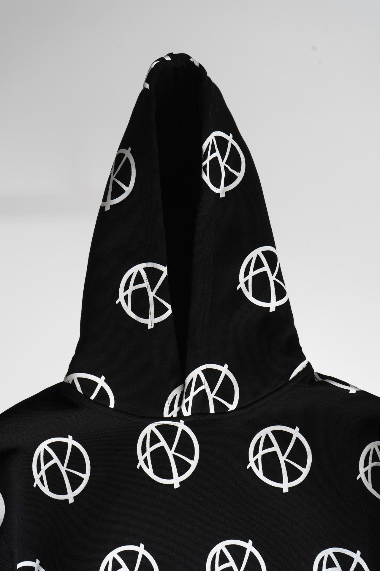 Detail of multi-logo print on hoodie of Anarchy Hoodie