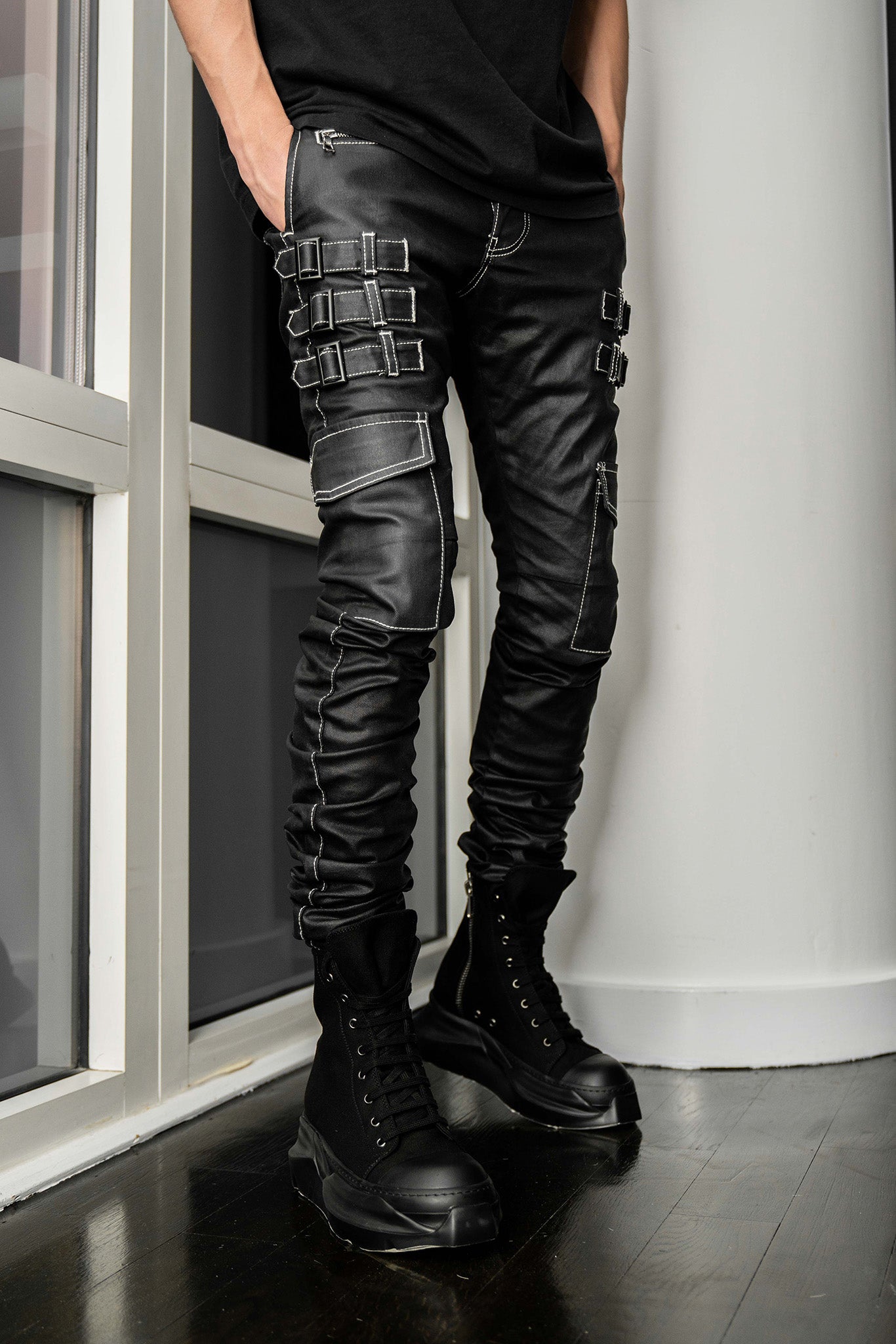 Front view of AKINGS Omari Jeans with white stitching contrast, dark denim