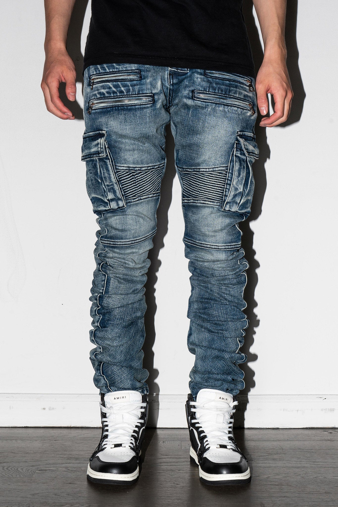 Detail of knee seam on Biker Stacked Jeans in blue