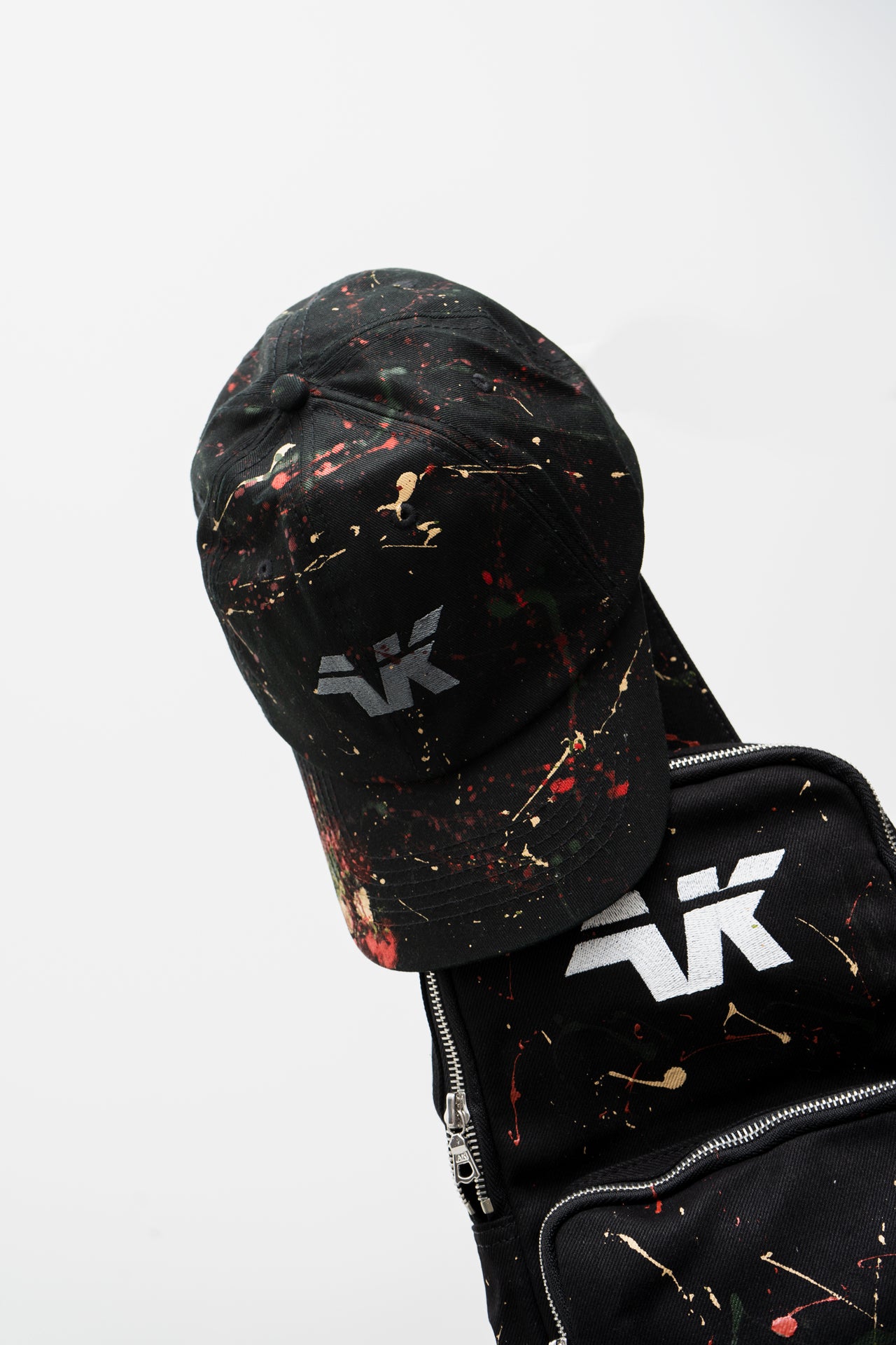 Paint splatter black hat and crossbody bag