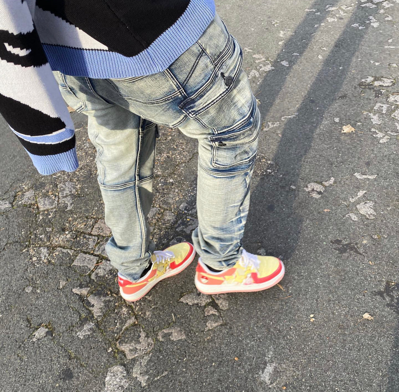 Lil Monkey (@youv_dee) wears the Jose Wong Bapesta "Yosansta" sneakers with the Kyle Blue cargo stacked jeans