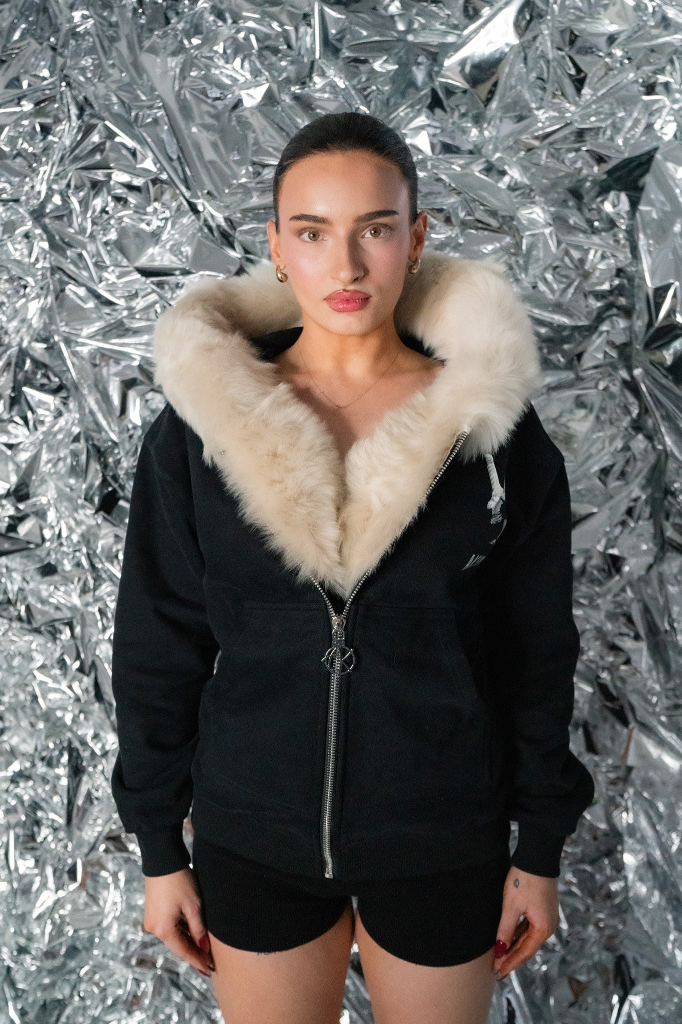 model not wearing the hoodie of GENUINE MERINO FUR PEACE ZIP HOODIE