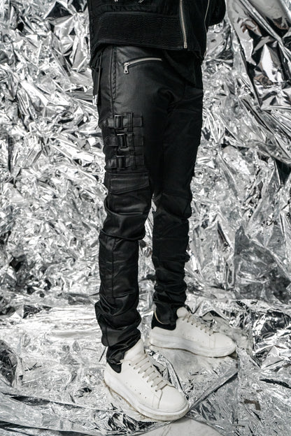 Side view of Omari Waxed Jeans showing the stack silhouette 
