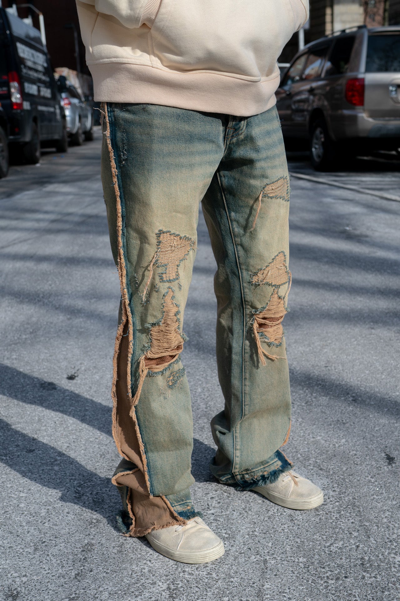 side view, inseam details and distressed design