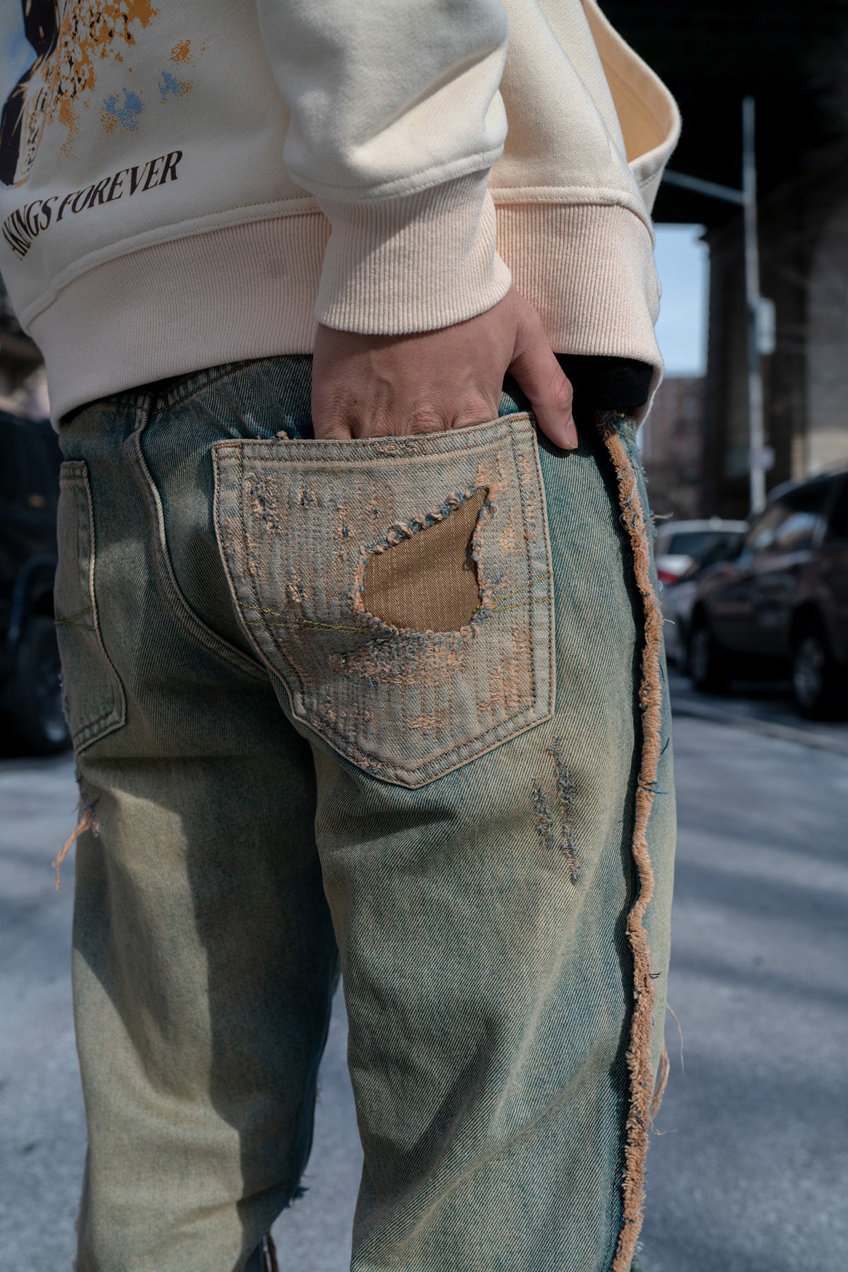 close-up view of pocket, with distressed design