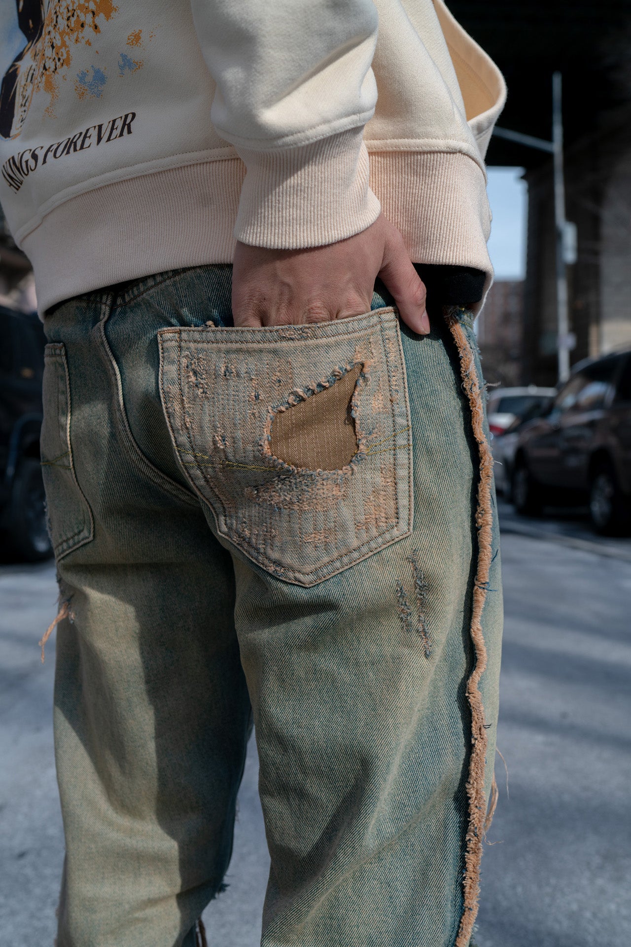 close-up view of pocket, with distressed design