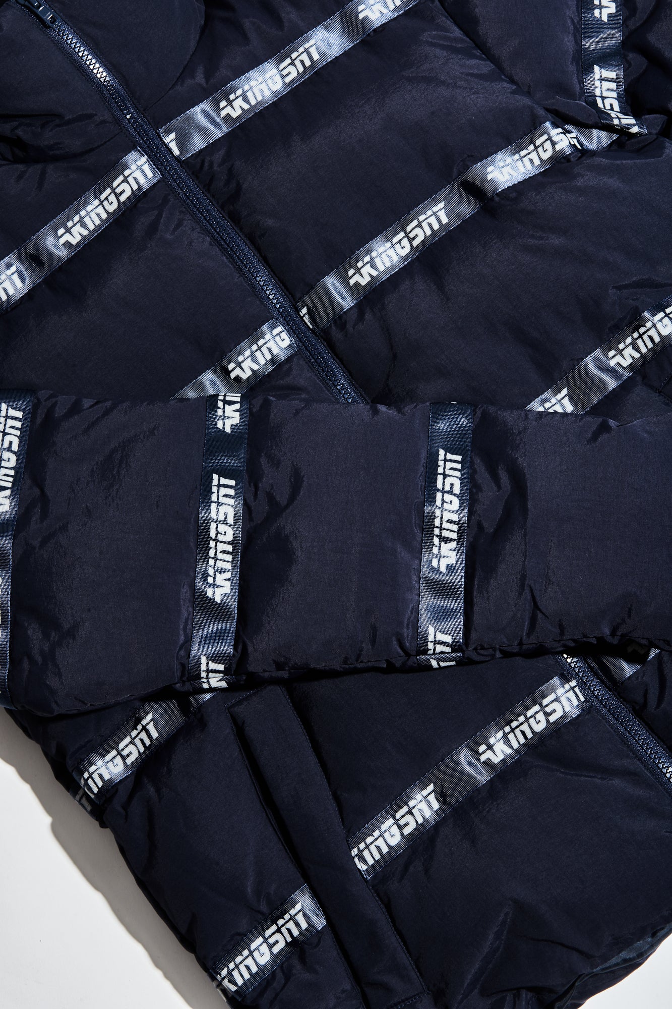 ogo Puffer Jacket showing sleeve and pocket design