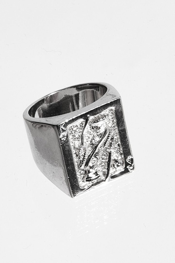 Detail of metal and ring on Card Ring 