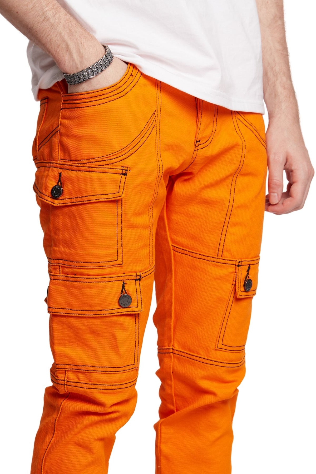 CLOSE UP VIEW OF BLACK STITCHES IN ORANGE KYLE SNAP CARGO PANTS