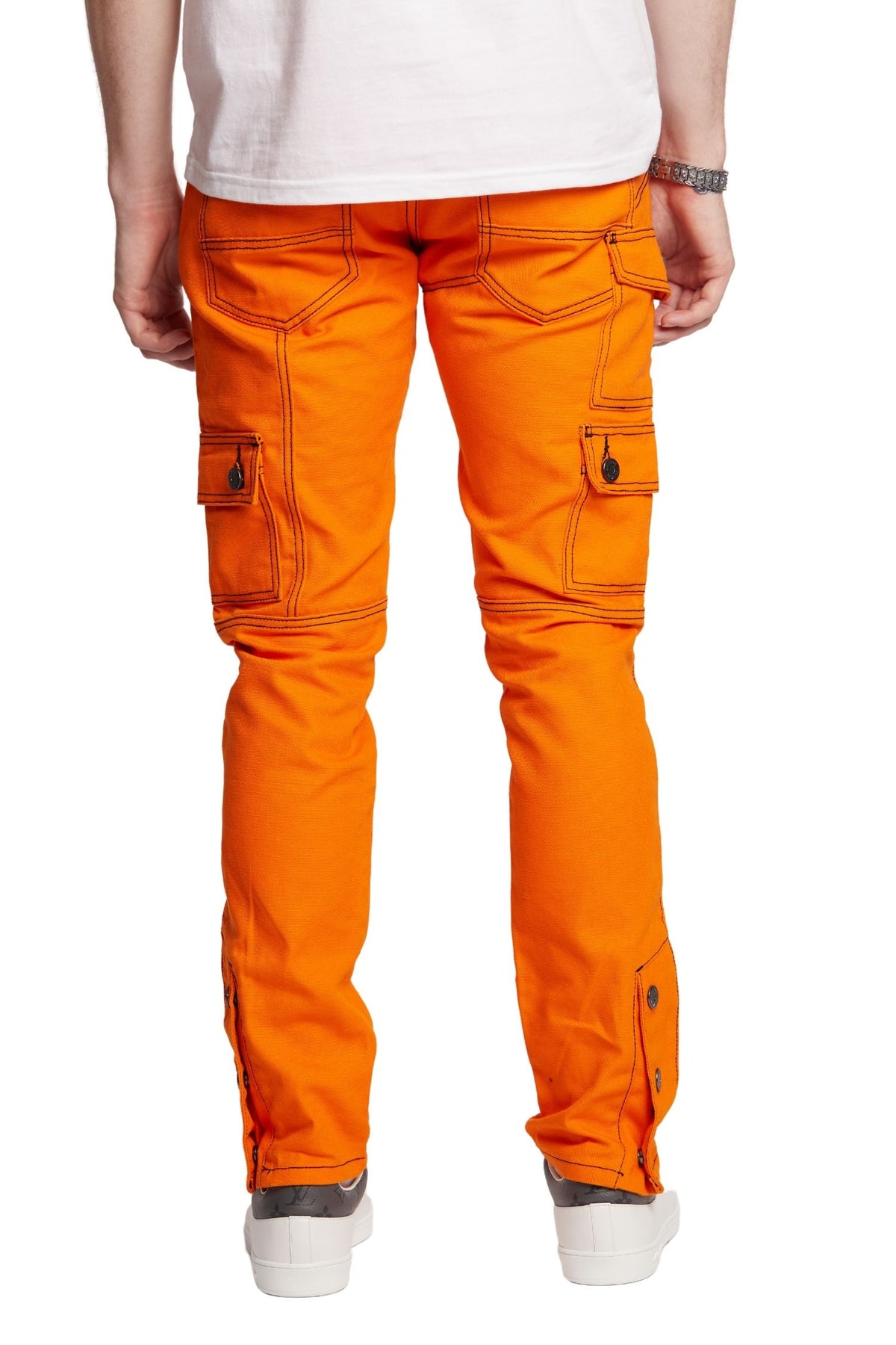 BACK VIEW AND DETAILS OF POCKETS ON KYLE SNAP CARGO IN ORANGE