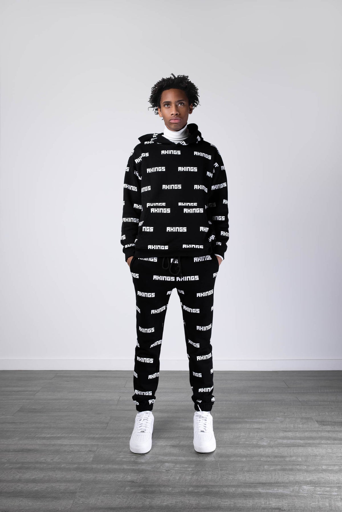 AKINGS 1984 Multi Logo Hoodie, front graphic logos across chest
