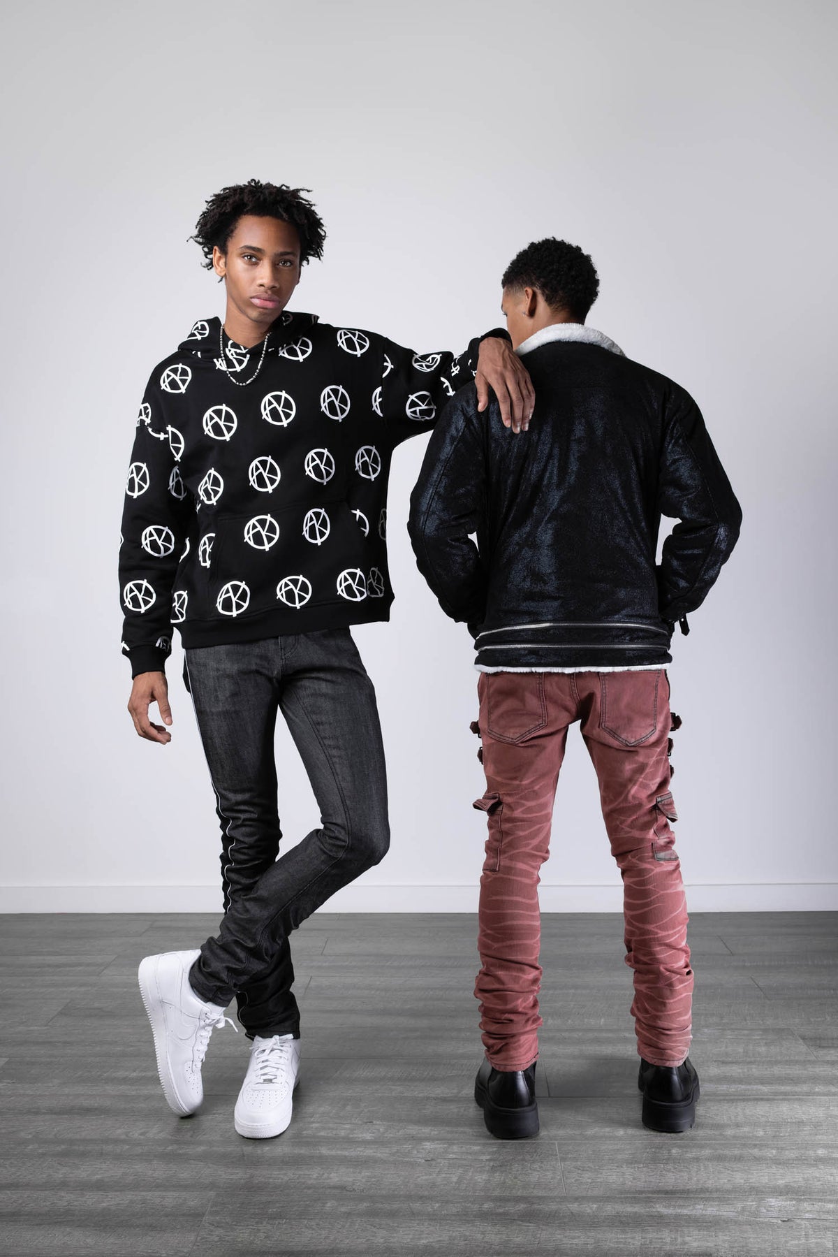 model wearing size large of Anarchy Multi Logo Hoodie
