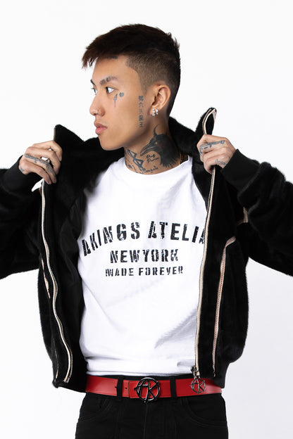 Close-up of logo on Atelier T-shirt