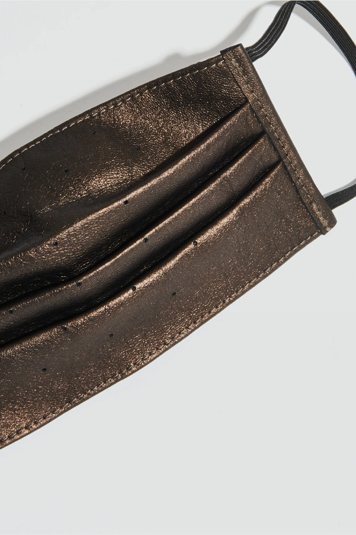 Close-up of fabric texture on Dust Gold Face Mask