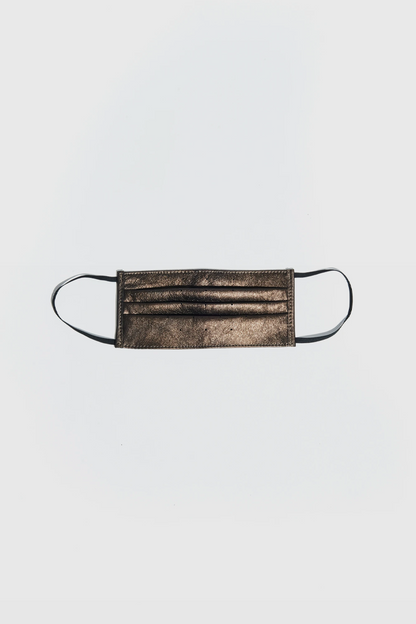 AKINGS Dust Gold Face Mask, shimmering gold color, front view
