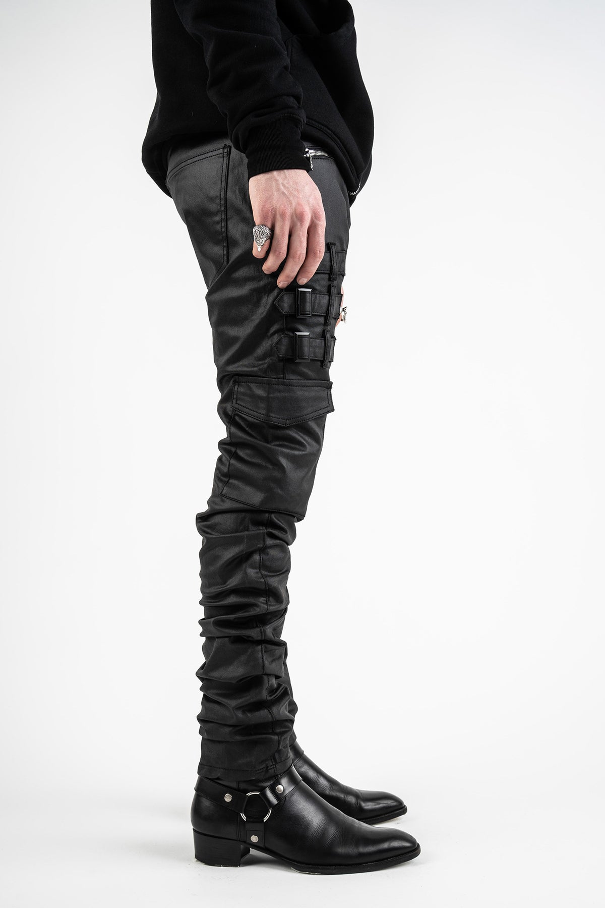 SIDE VIEW OF OMARI WAXED JEANS - AKINGS SHOWING THE SILHOUETTE OF STACKS 